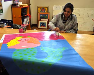 8Georgia painting at her desk